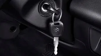 Interior kabin Suzuki Carry Pick Up yang menampilkan dasbor, setir, konsol tengah, dan jok pengemudi.