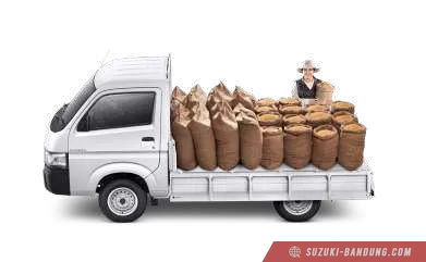 Suzuki Carry Pick Up baru warna putih, tampak dari depan samping, diparkir di luar ruangan.