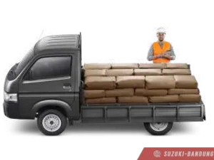 Suzuki Carry Pick Up terbaru berwarna putih, tampak samping depan dengan desain fungsional.